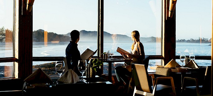 Diners sitting at a table looking out to the view